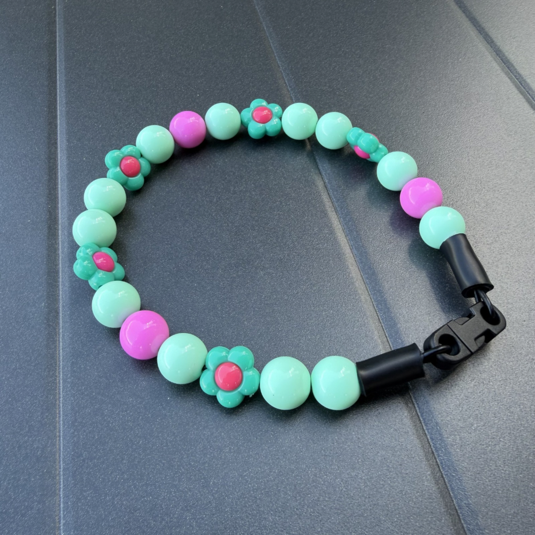 Close up detail of Odelia 14mm teal pink and acrylic flower beaded slip on dog collar by POPNCO handcrafted in BC Canada