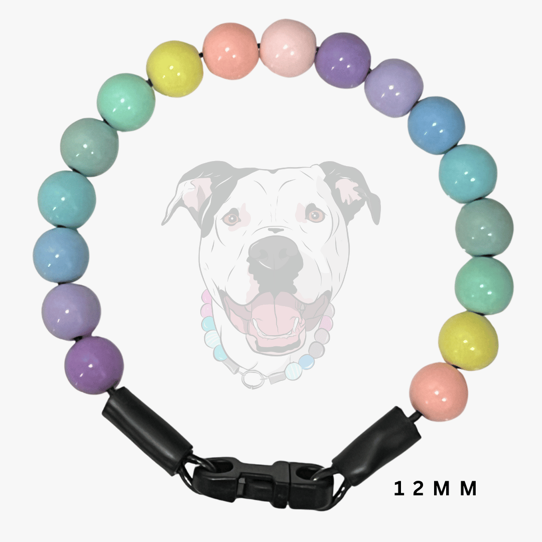 A pastel rainbow beaded dog collar with a black plastic buckle, displayed against a light gray background with a faint dog graphic and '12 MM' text.