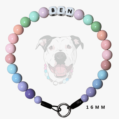 A pastel beaded pet collar with white letter beads spelling 'BEN' and a black clasp, shown on a light gray background with a faint dog illustration and '16MM' text.