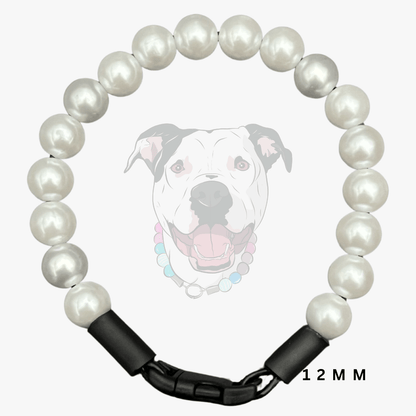 A 12mm pearl collar with a black metal clasp, shown against a light gray background with a faint dog graphic and '12 MM' text overlay.