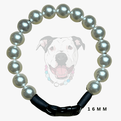 A dog collar made of 16mm round gray pearls and a black plastic buckle, shown against a white background with a faint dog graphic and '16MM' text.