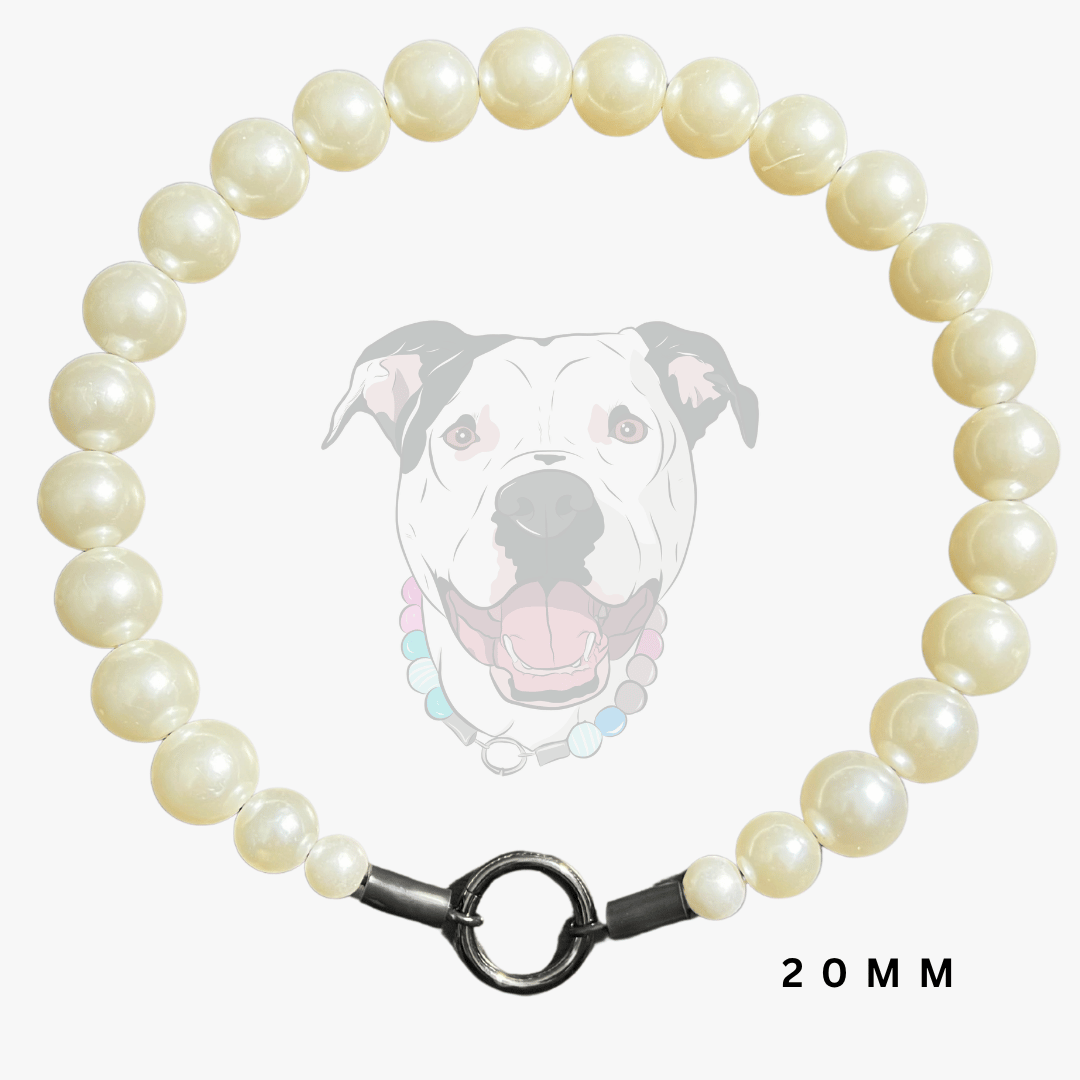 A beaded dog collar necklace made of cream-colored faux pearls with a dark metal clasp, shown against a light gray background with a faint dog illustration and '20MM' text.