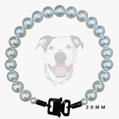 A dog collar made of 20mm round white faux-pearl beads with a black metal clasp, shown against a light gray background with a faint graphic of a dog wearing the collar.