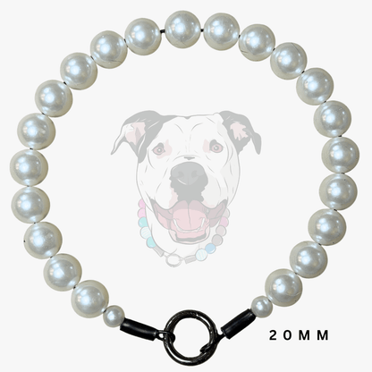 A 20mm pearl collar for dogs, featuring a circular arrangement of white lustrous pearls and a black metal clasp, shown against a light gray background with a faint dog graphic.