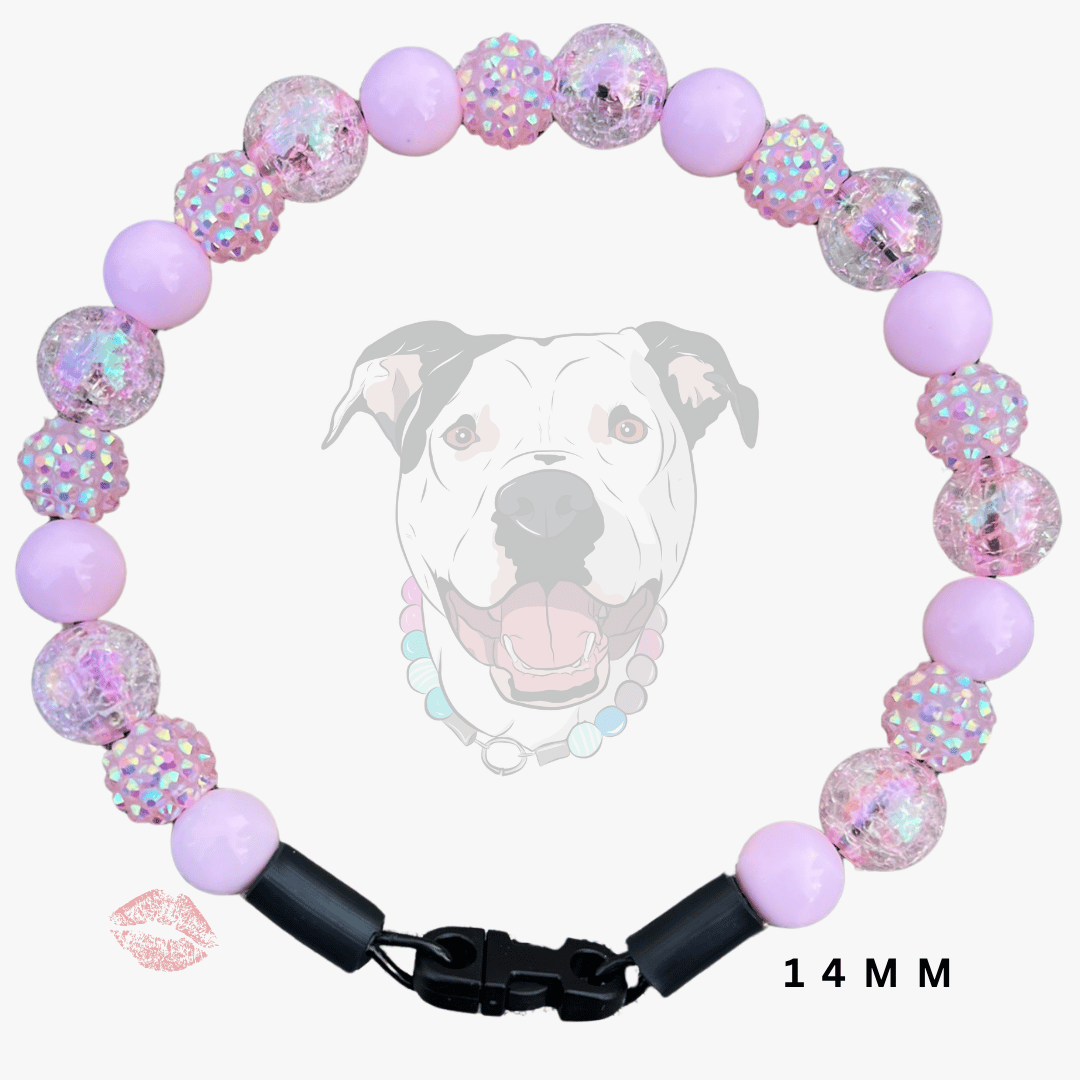 A beaded dog collar necklace featuring light purple beads, pink glitter-filled round beads, and clear beads with iridescent glitter. The collar has a black plastic clasp and is displayed against a white background with a faint dog graphic and '14 MM' text overlay.