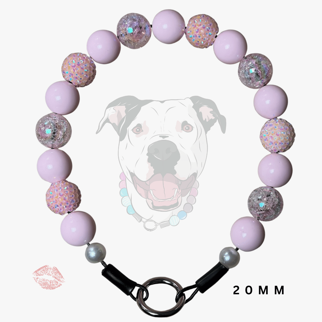 A beaded dog collar necklace made of light purple/lavender beads and glittery iridescent beads, with a black clasp and silver-toned ring, shown on a white background with a faint dog graphic and '20MM' text.