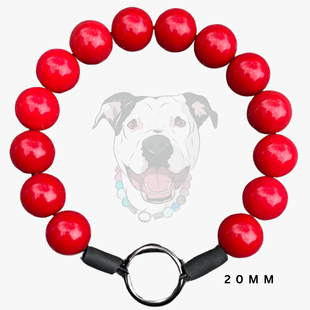 A red beaded dog collar with glossy red round beads, black collar bands, and a silver metal ring clasp, shown on a light gray background with a faint dog graphic and '20MM' text.