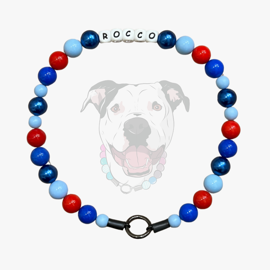 Colorful beaded collar with 'Rocco' on a white background, featuring an inset of a dog's face.