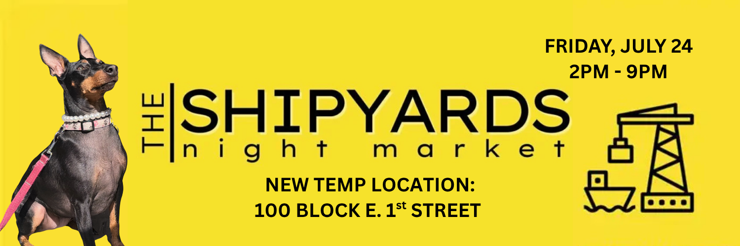 A yellow promotional banner for 'The Shipyards Night Market' with black text, a small black-and-tan dog on the left, and a crane icon on the right. The banner includes event details: Friday, July 24, 2 PM - 9 PM, and new temp location at 100 Block E.