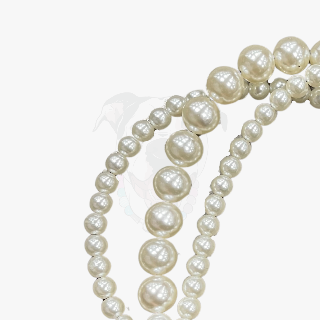 Pearl necklace on a white background POPNCO
