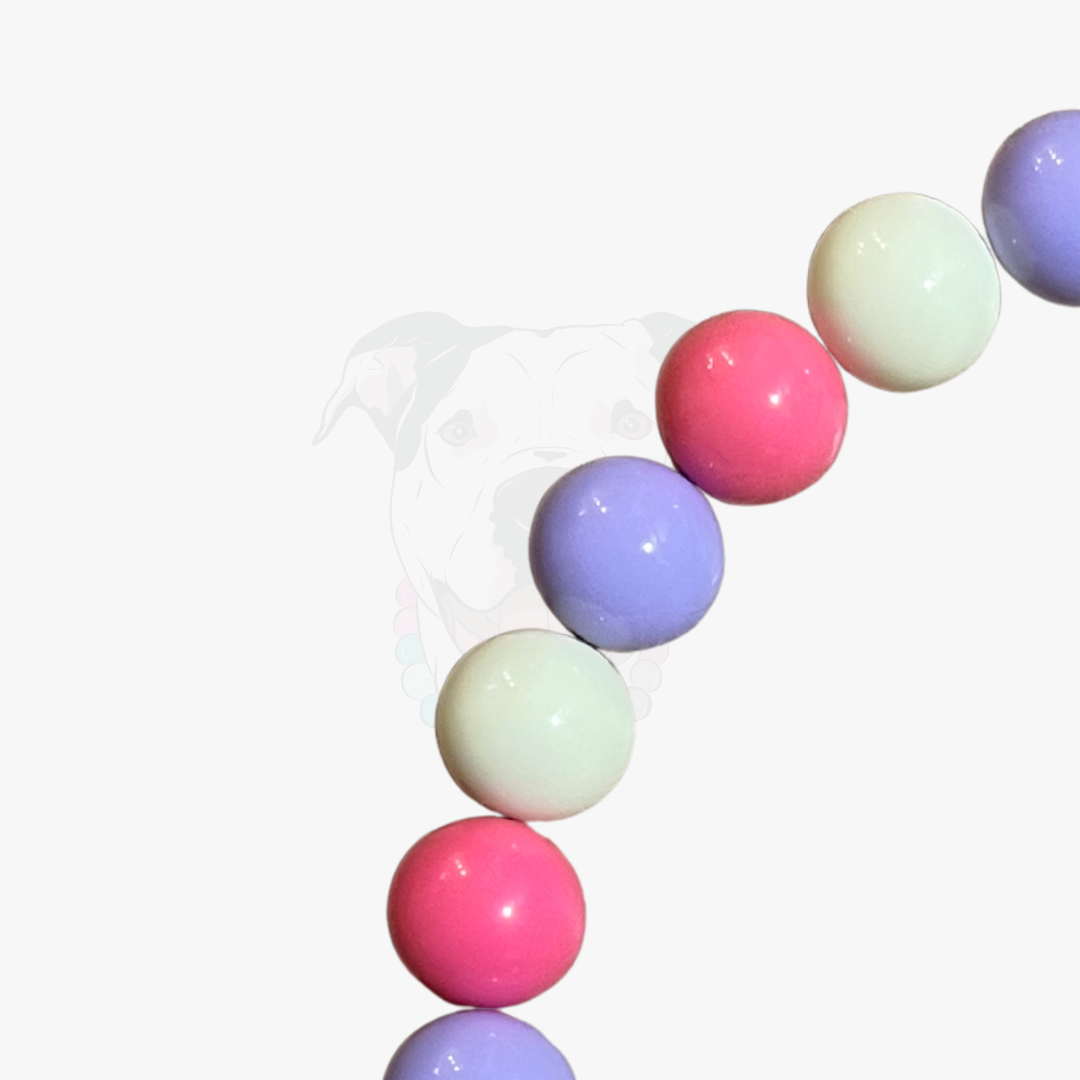 Pastel-colored round beads on a white background
