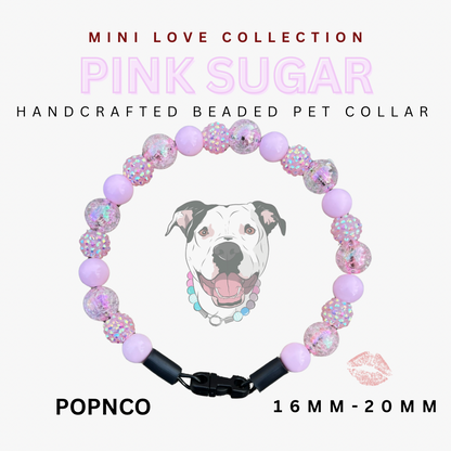 Handcrafted beaded pet collar with pink sugar design on a white background