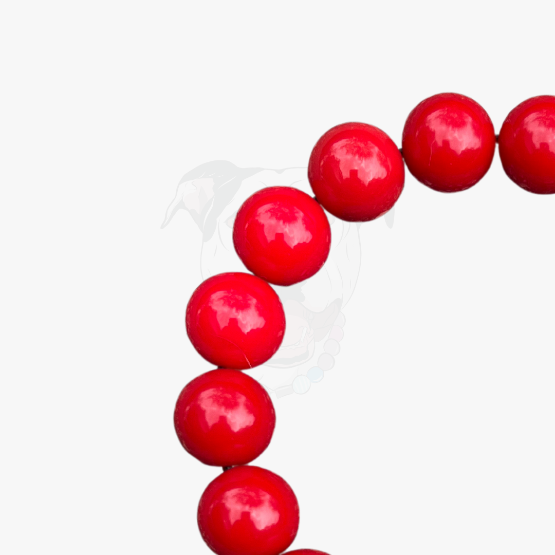 Red beaded bracelet on a white background