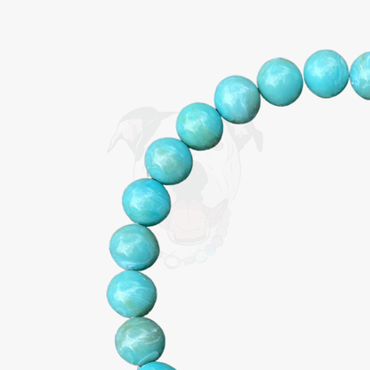 Turquoise beaded bracelet on a white background POPNCO Acrylic Beads, beaded collar, Beaded dog collar, blue dog collar, Breathable dog collar, cat collar, Comfortable Dog Collar, dog collar, Durable dog collar, Easy to clean dog collar, fashion collar, handmade, Pet accessories, pet collar, popnco, Popnco dog collar, slip on collar, Slip on dog collar, Stylish dog collar