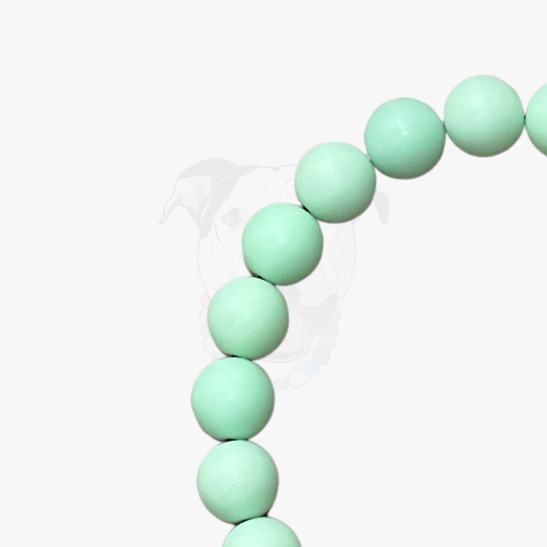 Mint green beaded bracelet on a white background