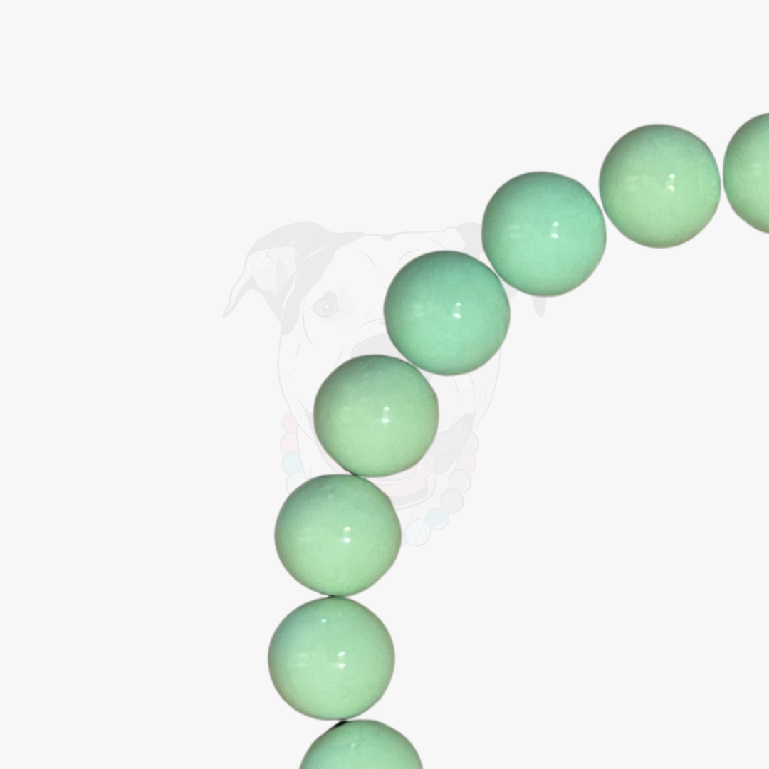 Green beaded bracelet on a white background