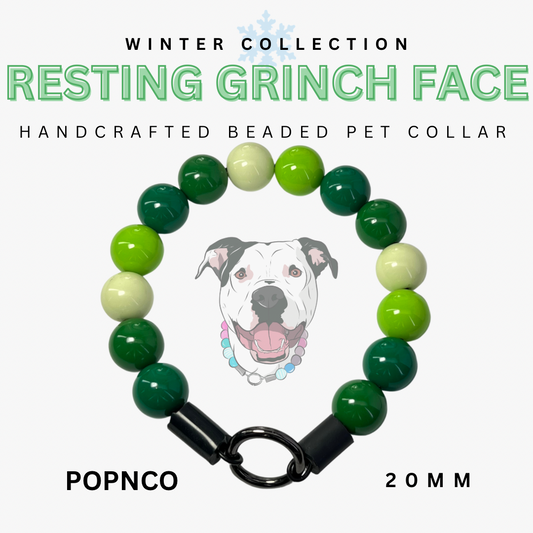 Handcrafted beaded pet collar with green and white beads and a black clasp, featuring a dog illustration and text about the 'Resting Grinch Face' collection.