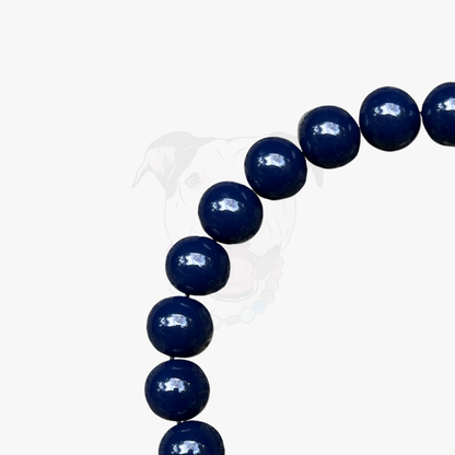 Navy blue beaded bracelet on a white background
