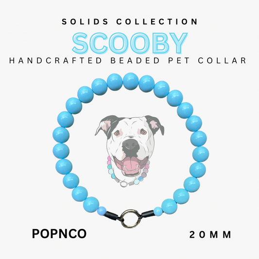 Handcrafted beaded pet collar with blue beads and a dog illustration on a white background