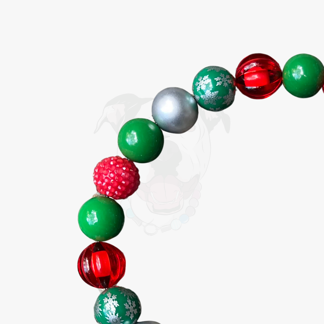 Colorful beaded bracelet with red, green, and silver beads on a white background