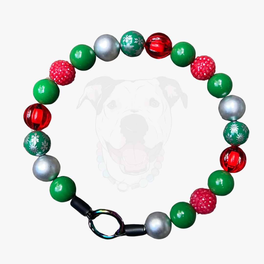 Colorful beaded bracelet with red, green, and silver beads on a white background