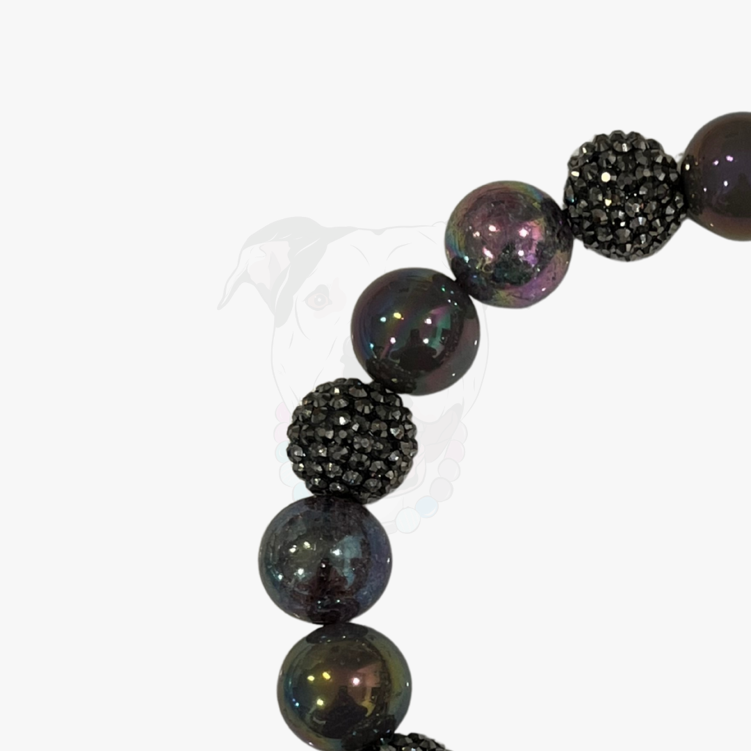 Beaded bracelet with black and gray beads on a white background