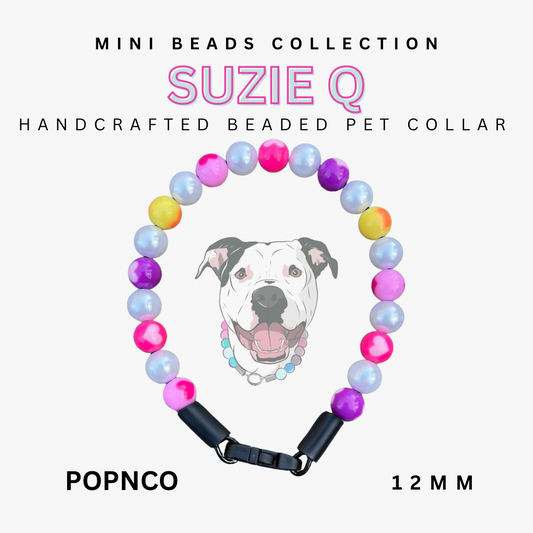 Handcrafted beaded pet collar with colorful beads and a dog's face on a white background, branded 'Suzie Q'. POPNCO Acrylic Beads, beaded collar, Beaded dog collar, blue dog collar, Breathable dog collar, cat collar, Comfortable Dog Collar, dog collar, Durable dog collar, Easy to clean dog collar, Easy to clean dog collars, fashion collar, handmade, Pet accessories, pet collar, popnco, Popnco dog collar, slip on collar, Slip on dog collar, Stylish dog collar
