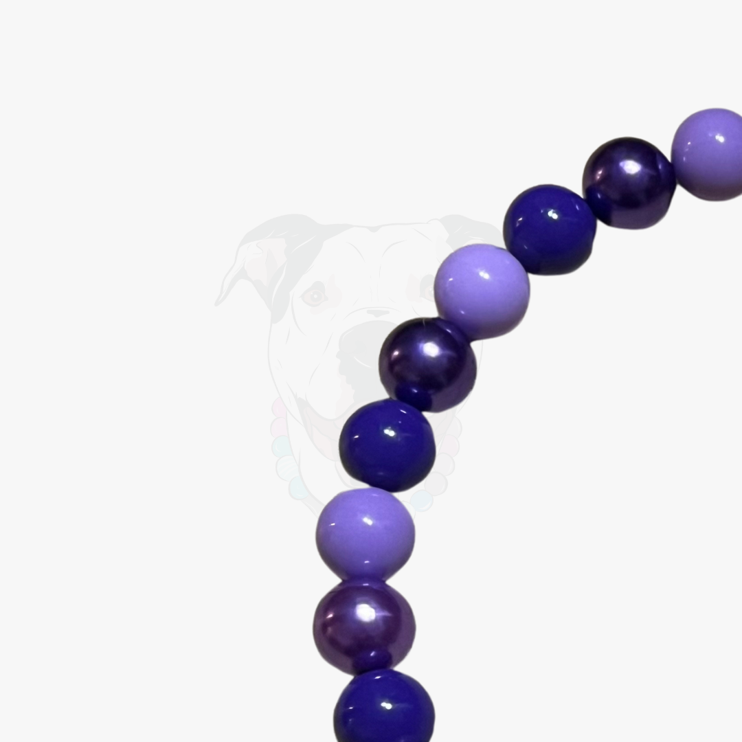 Purple beaded bracelet on a white background