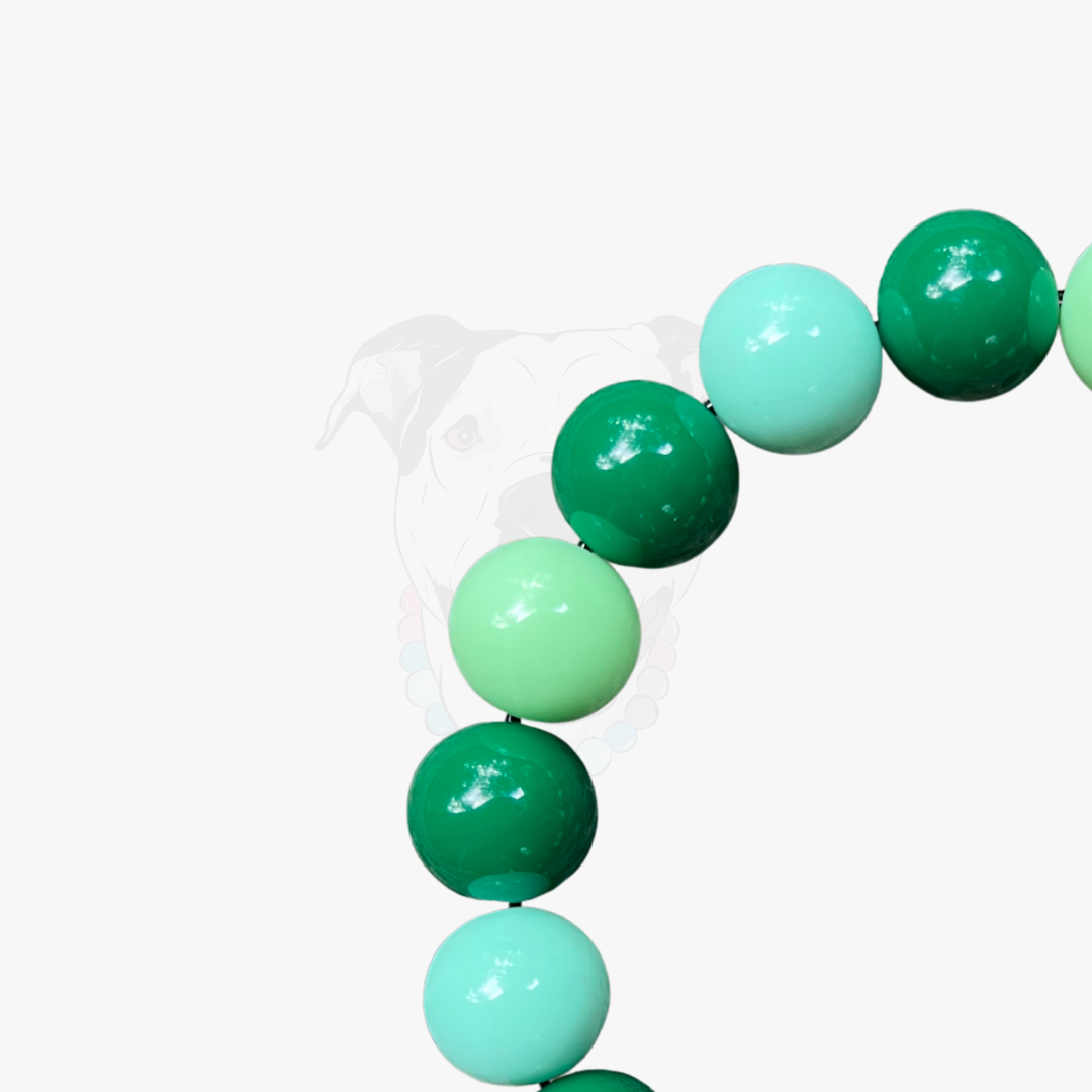 Green and teal bubblegum balloons on a white background