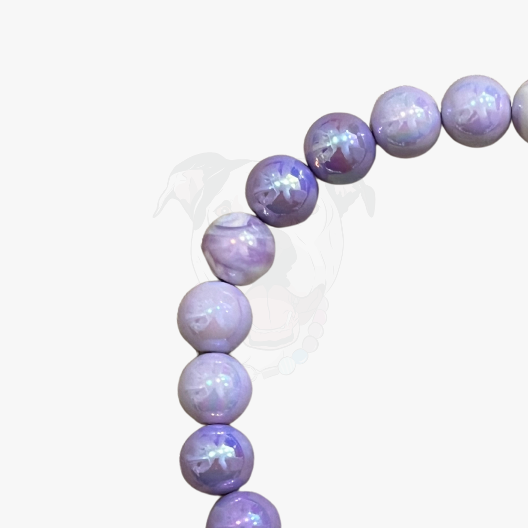 Purple beaded bracelet on a white background