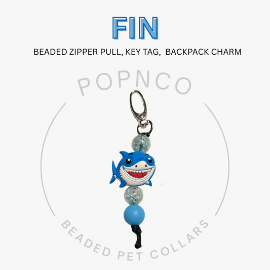 Shark-themed beaded zipper pull, key tag, or backpack charm with 'FIN' and 'POPNCO' branding on a white background.