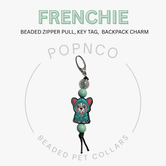 Beaded zipper pull, key tag, or backpack charm with 'FRENCHIE' text and 'POPNCO' branding on a white background.