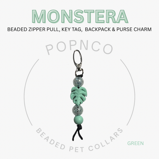 Green beaded zipper pull, key tag, backpack & purse charm with 'Monstera' text on a white background.