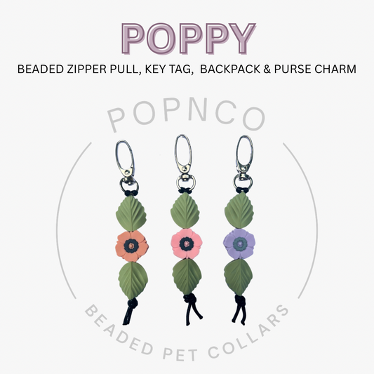 Three beaded zipper pull, key tag, and backpack & purse charm with floral designs on a white background.