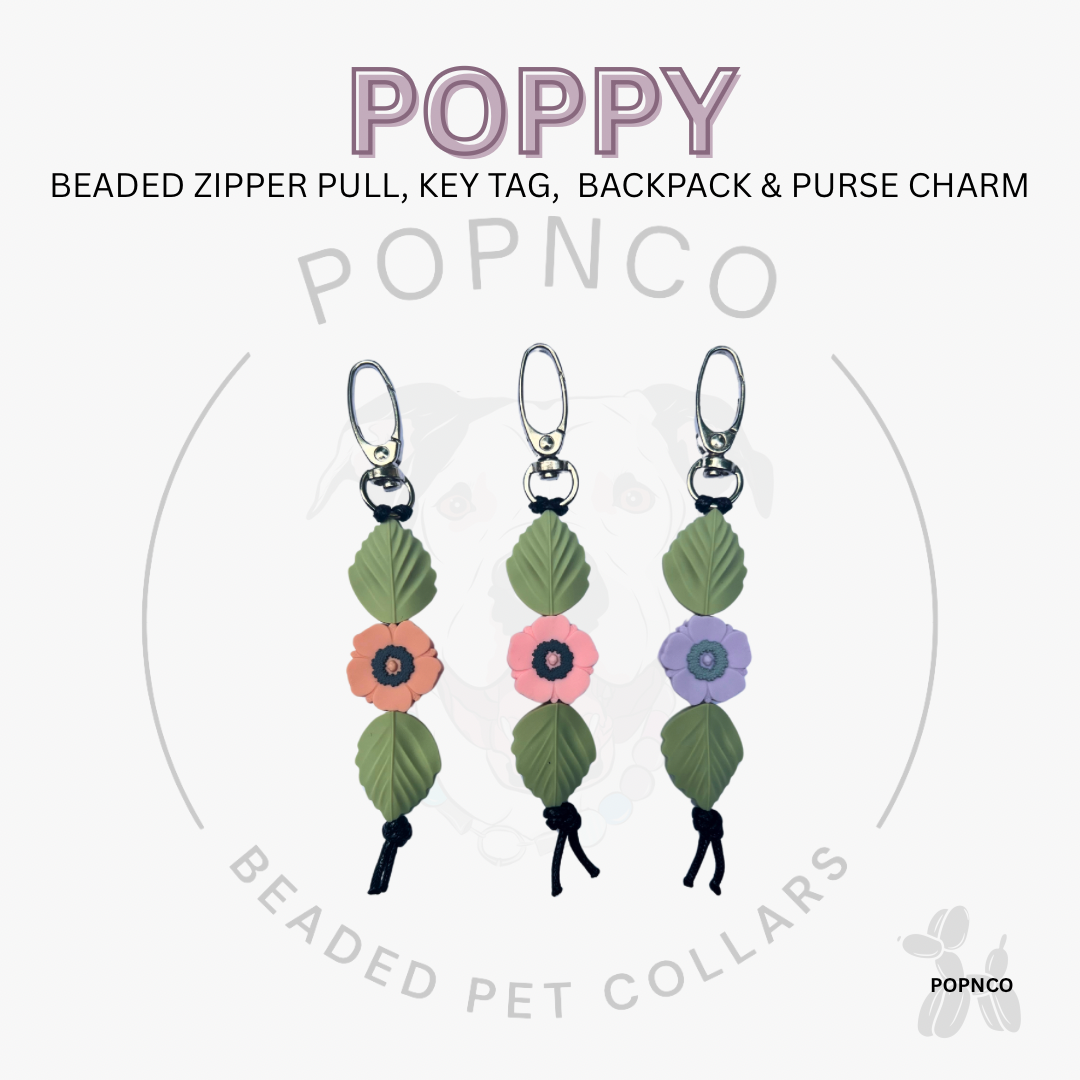 Beaded zipper pull, key tag, backpack & purse charm with floral design on a white background