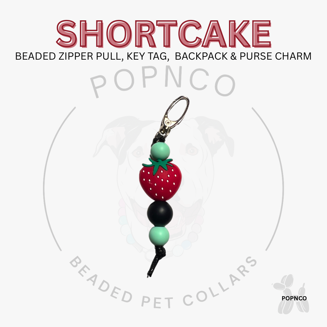 Beaded zipper pull, key tag, backpack & purse charm with 'Shortcake' text and 'POPNCO' branding.