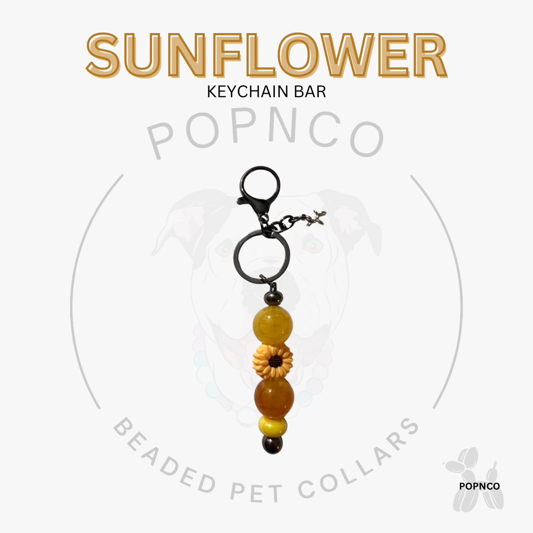 Sunflower keychain bar with beads on a white background, featuring the POPNCO brand.