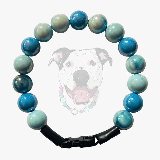 Close up of The Nelson beaded dog collar by POPNCO, featuring bright, iridescent AB acrylic beads that shimmer in the light, strung on heavy-duty cable.