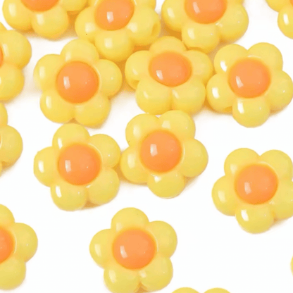 Close up of bright green yellow and flower shaped acrylic beads used in the Vern collar by POPNCO handcrafted in BC