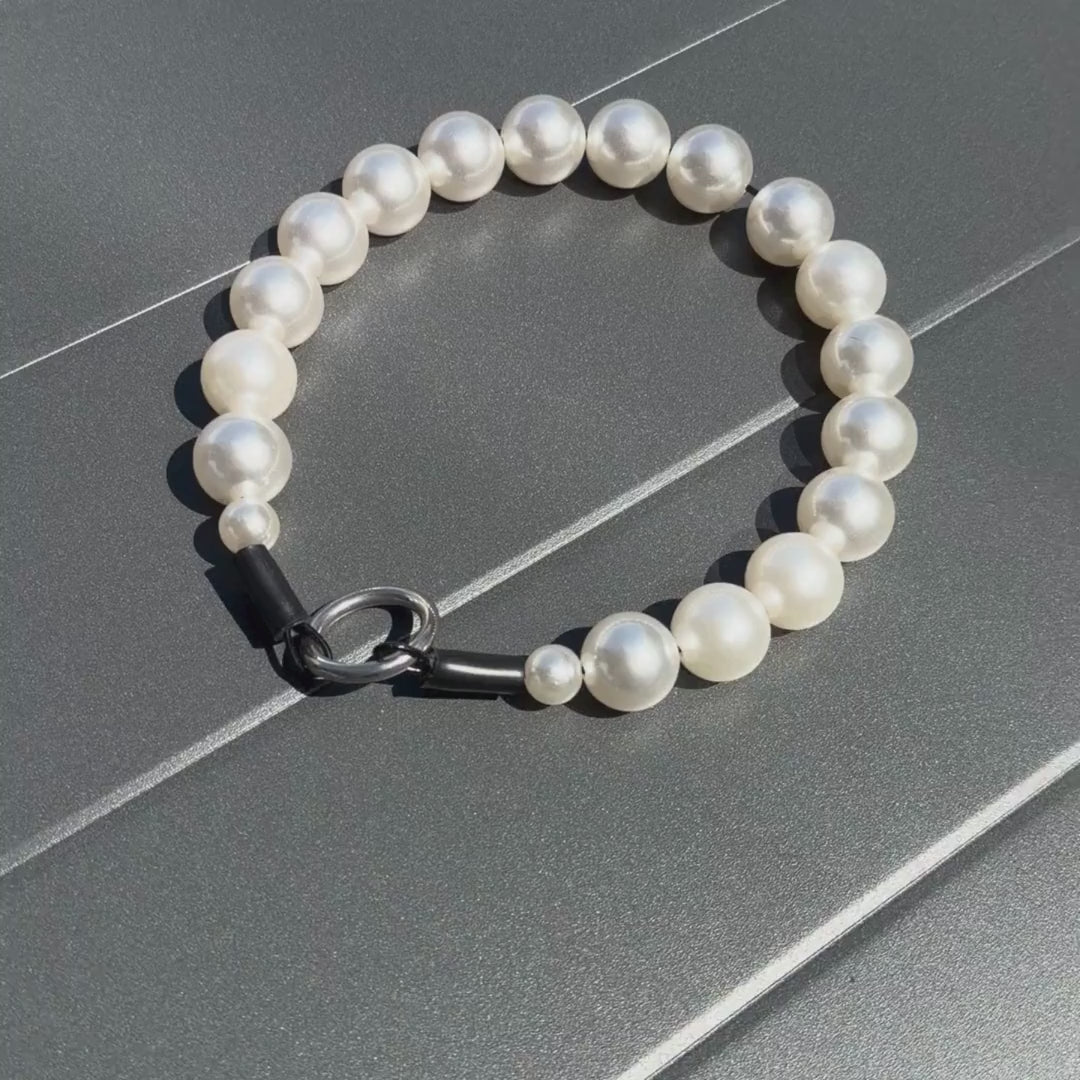 Video of Pearl beaded pet Collar from POPNCO on a Grey Table. 
