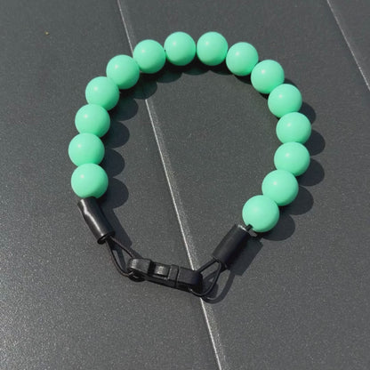 POPNCO Solid Classic Pale Green Beaded pet Collar 14mm Everette video of the collar laying flat on a black table . 