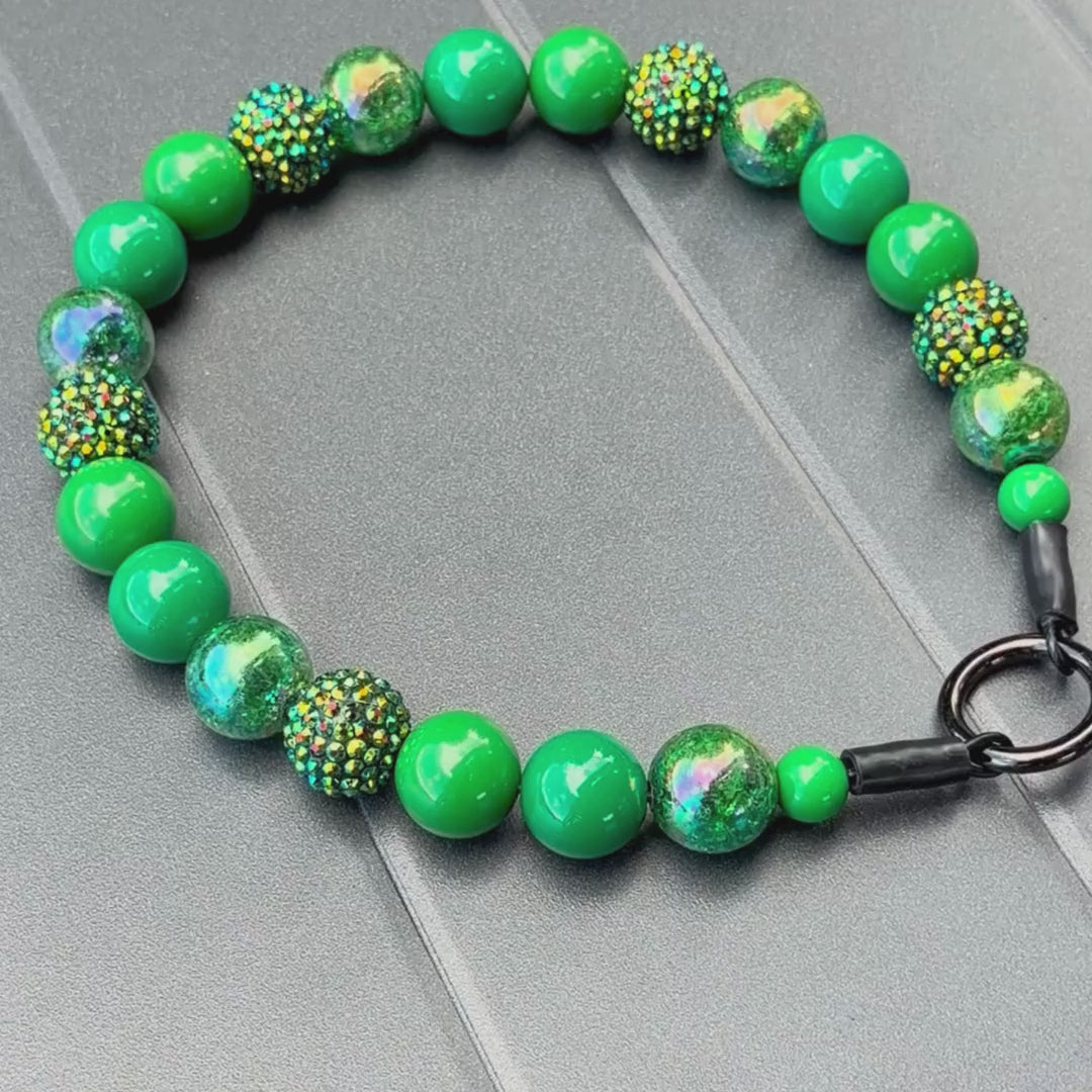 Evergreen Beaded Pet Collar laying Flat on a Grey Table 